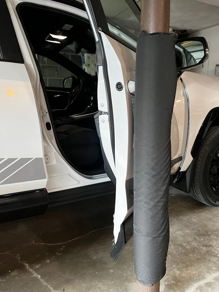 Black Garage Pole Pad helps prevent dings and dents on car door.