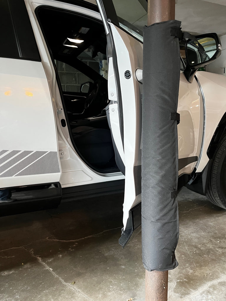 Black Garage Pole Pad helps prevent dings and dents on car door.