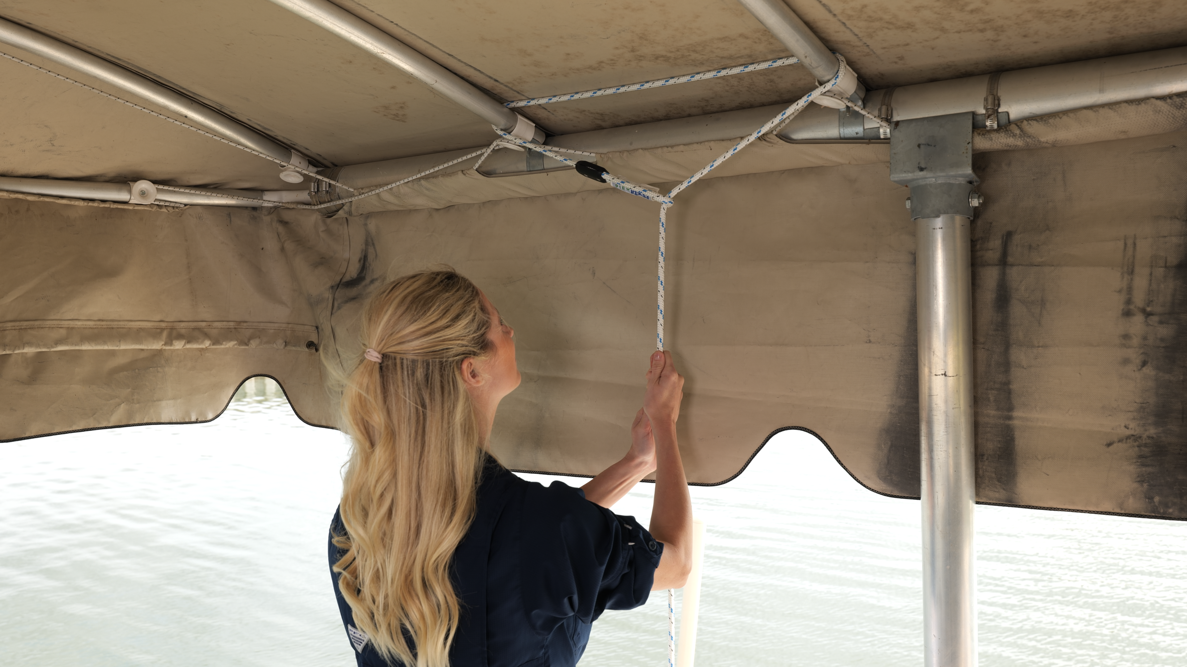 Boat dock safety cable provides stability when boarding or exiting a boat from a boat dock.  