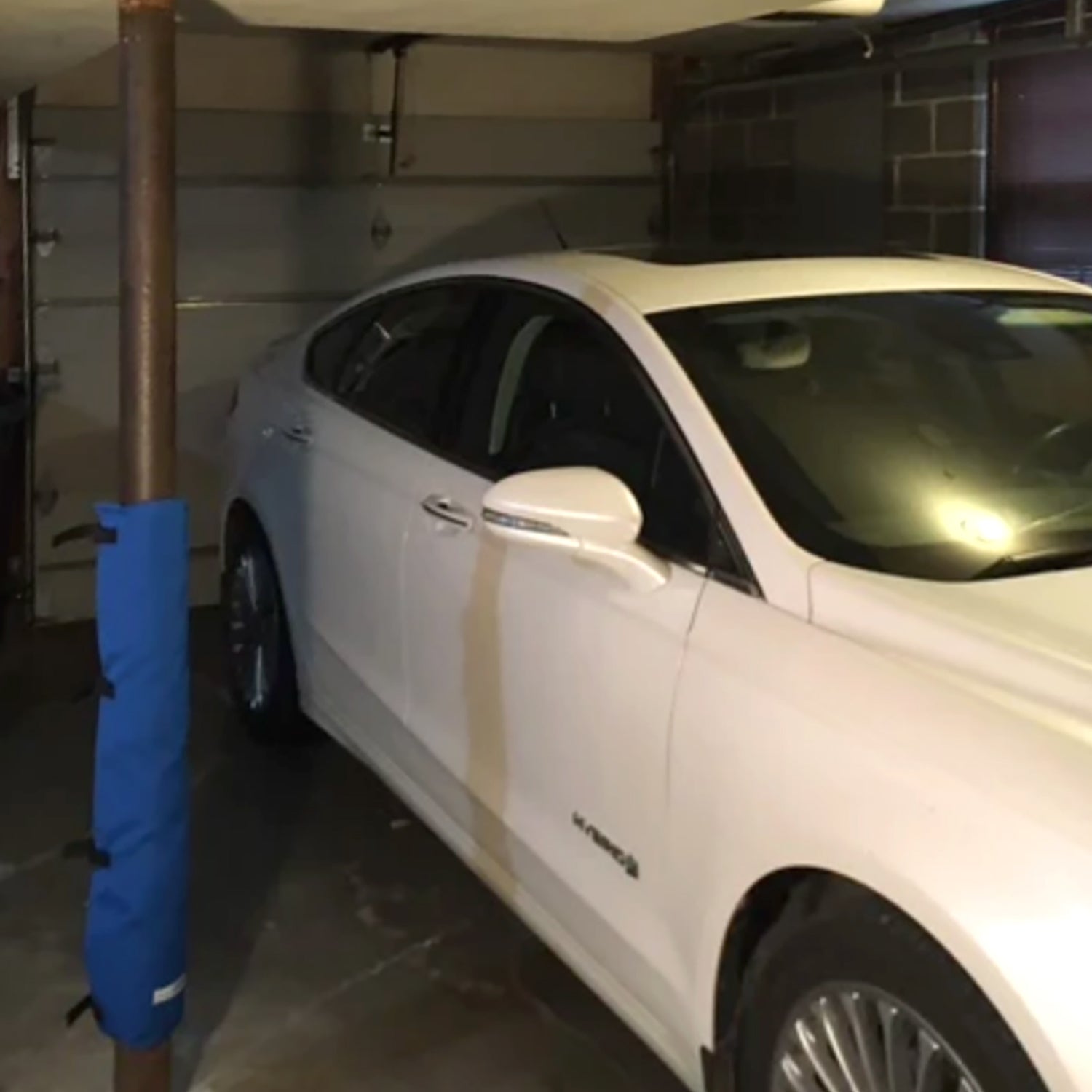 Blue Padding for garage poles. Garage pole pad that secures to your garage pole to prevent dings and dents on your car door.